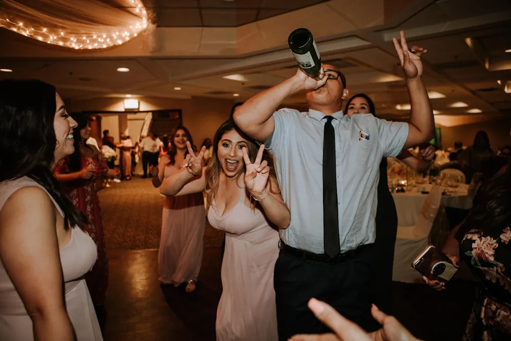 A lively wedding dance floor celebration, in the Capture Film style